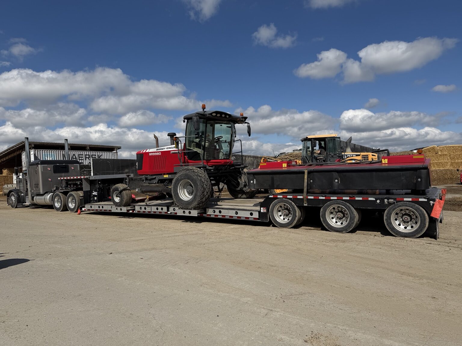 Massey Ferguson windrower and header secured for delivery