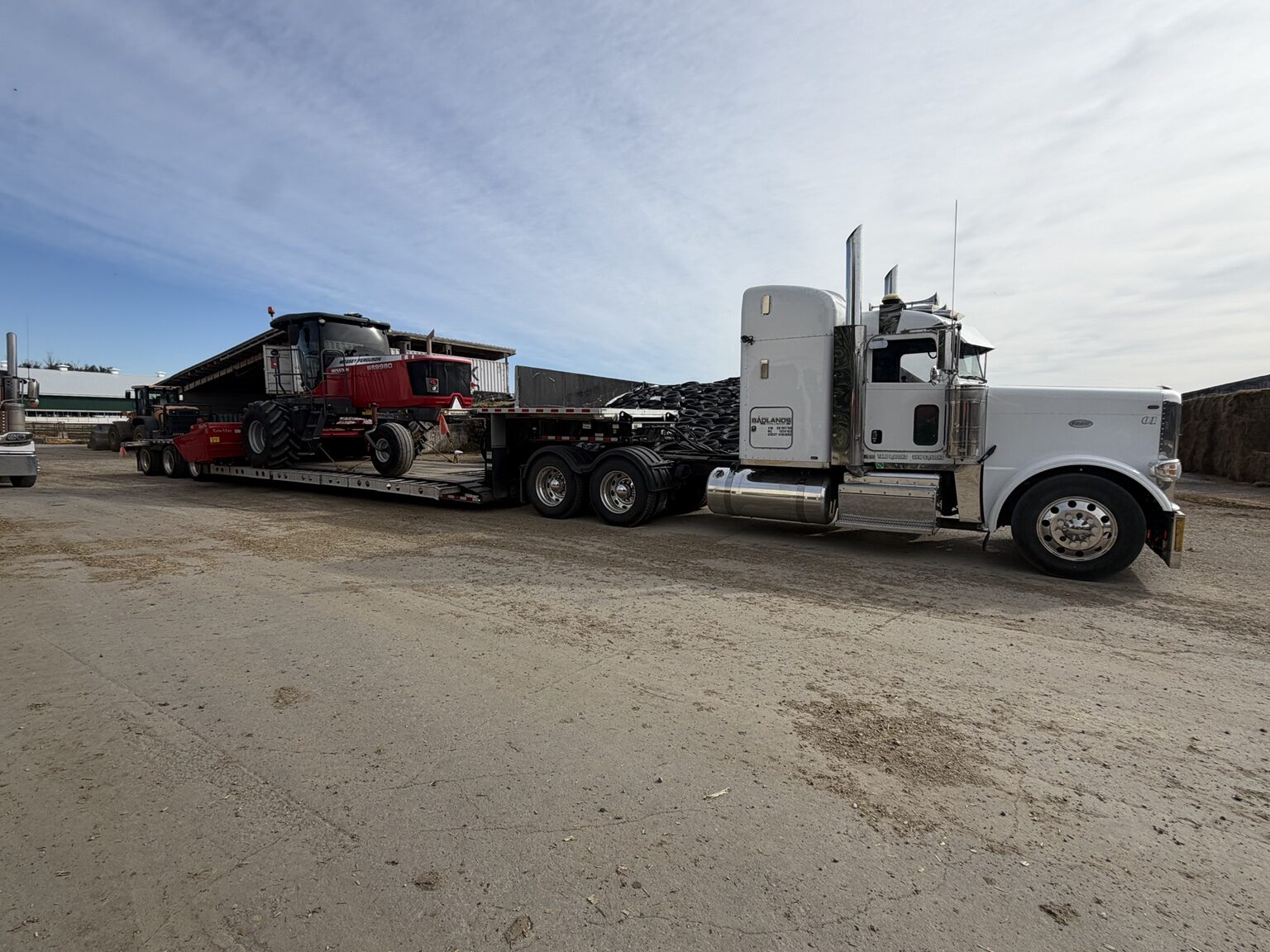 Massey Ferguson windrower loaded for transport